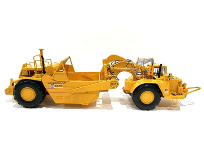 CAT 657E Scraper side view