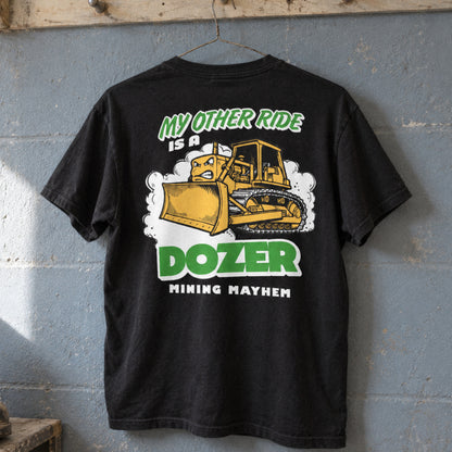 Black Dozer t-shirt hanging on a boot room peg rail, back print