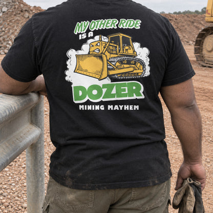 Operator wearing the black Dozer t-shirt by a stockpile on site