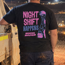 Miner wearing the black Night Shift Happens t-shirt on site at night, back print